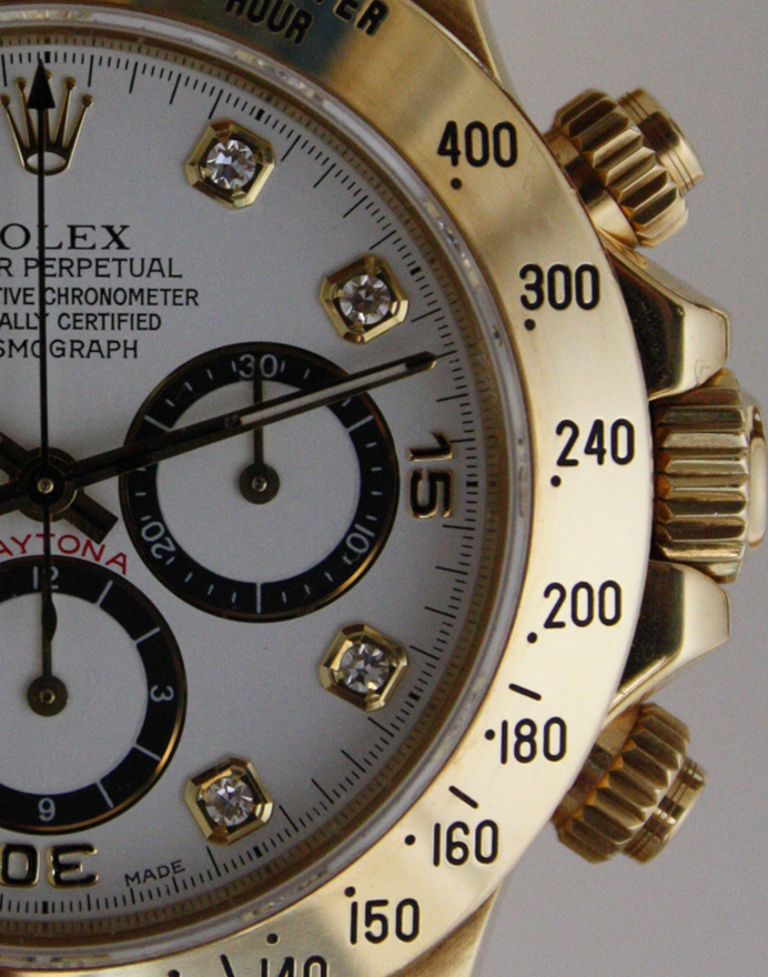 Editorial lifestyle photograph evoking "best watches for a black tie event on a budget": an elegant unbranded wristwatch on a textured neutral surface, soft directional window light, shallow depth of field, premium magazine style. No logos, no brand names, no text overlays.