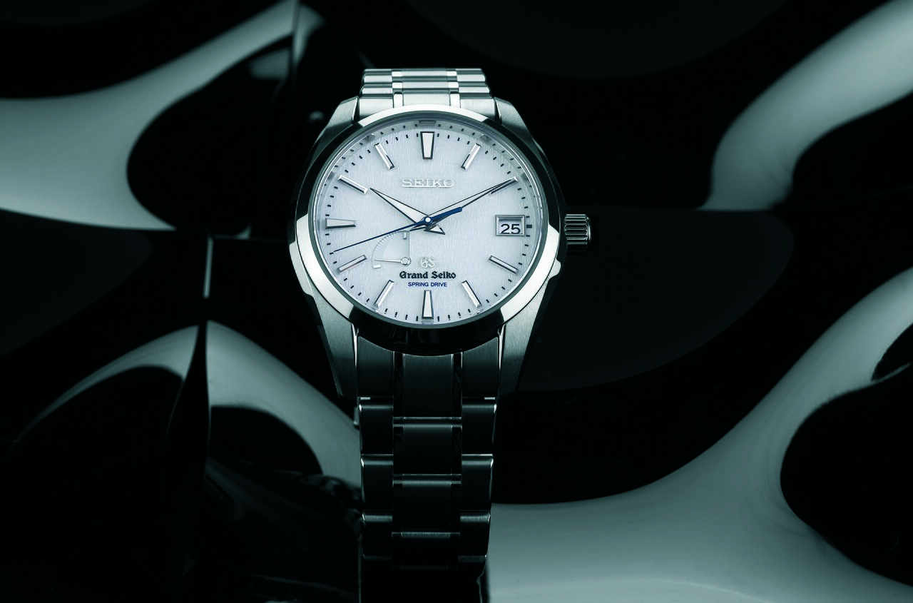 Grand Seiko Snowflake (SBGA011, the SBGA211's domestic-market twin) with textured white dial and blued seconds hand