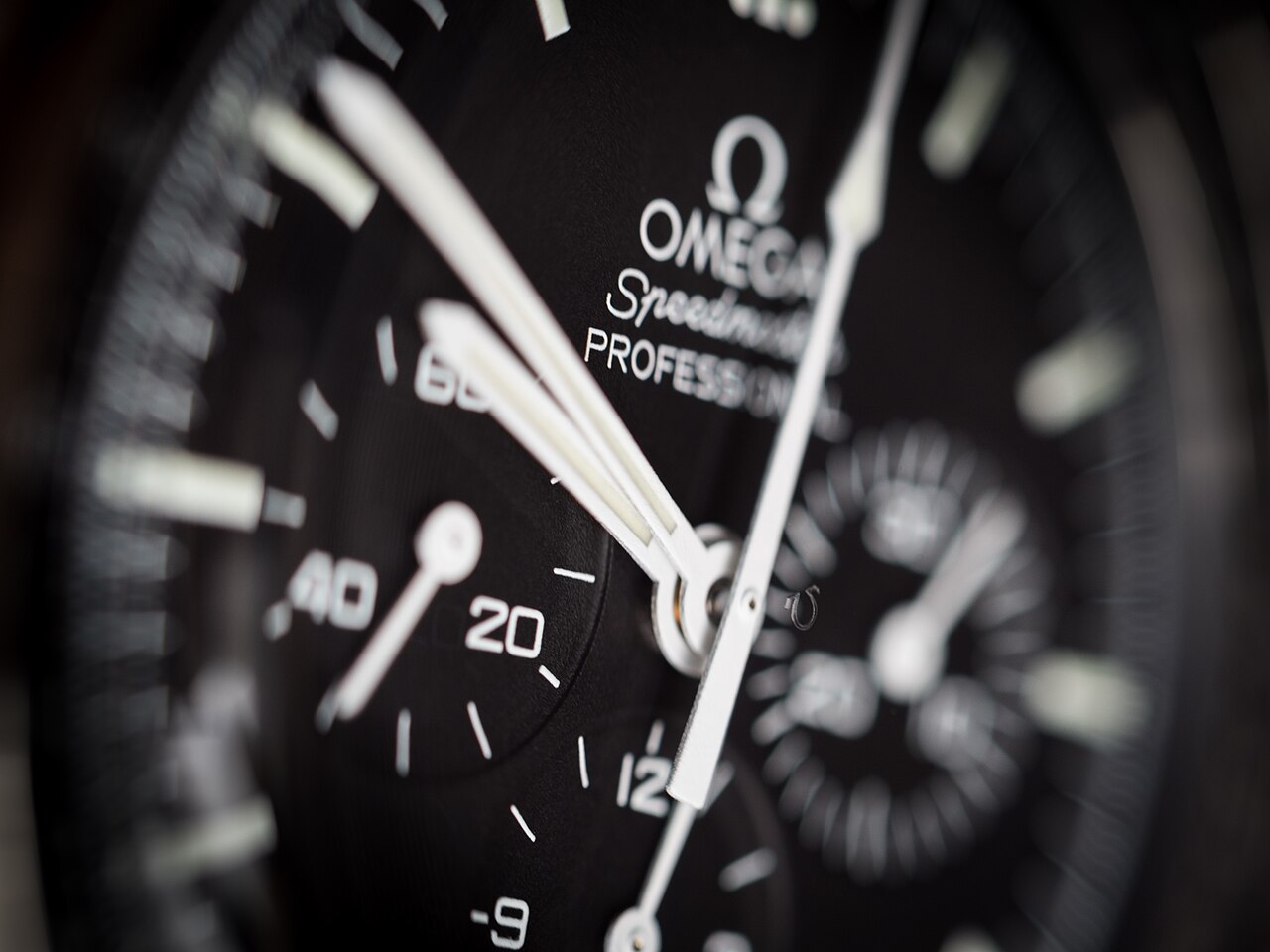 Omega Speedmaster Professional Moonwatch with black step dial and steel bracelet (hesalite sibling ref. 311.30.42.30.01.005 shown)